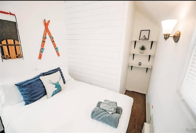 bedroom featuring dark hardwood / wood-style floors