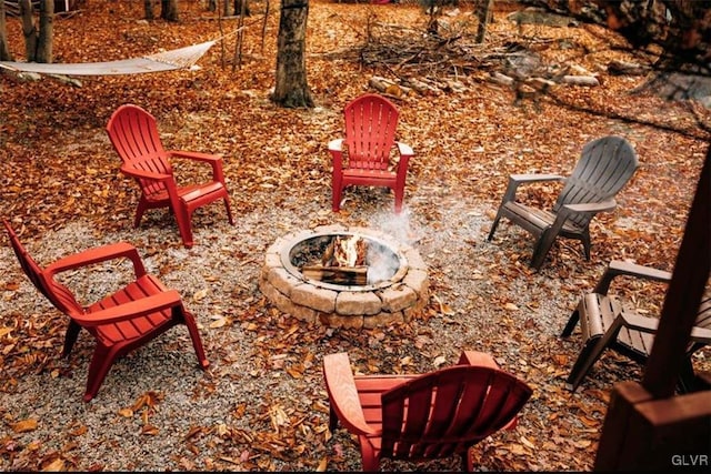 exterior space featuring an outdoor fire pit