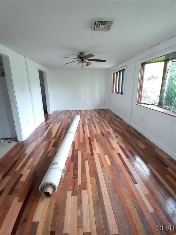 spare room featuring ceiling fan and hardwood / wood-style flooring