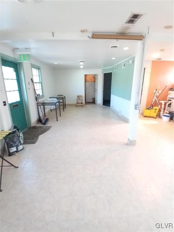 basement featuring light floors and visible vents