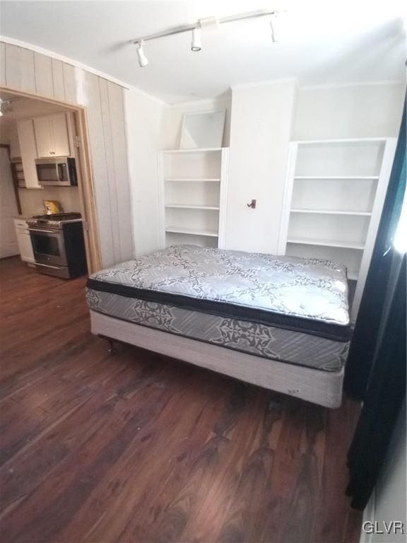 bedroom with dark wood-type flooring