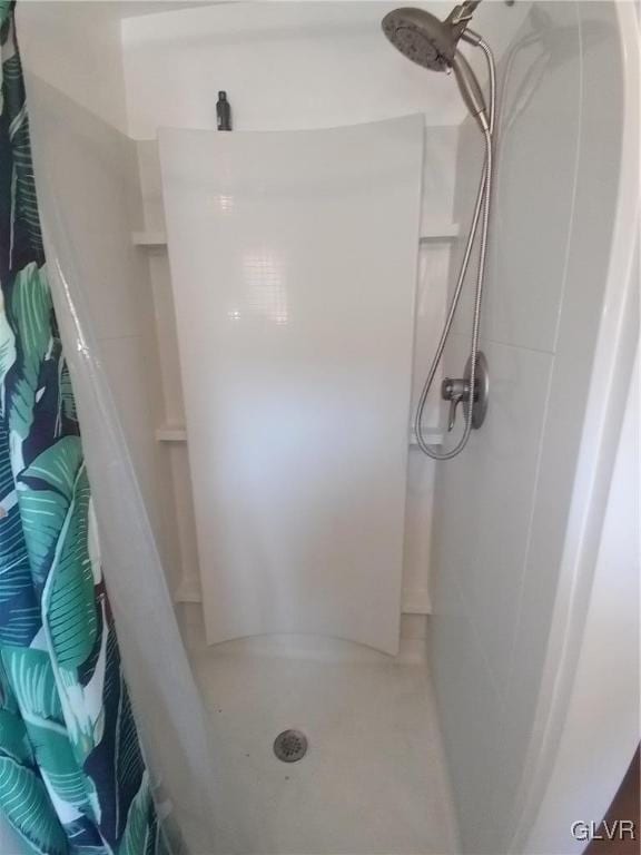 full bathroom with a shower stall