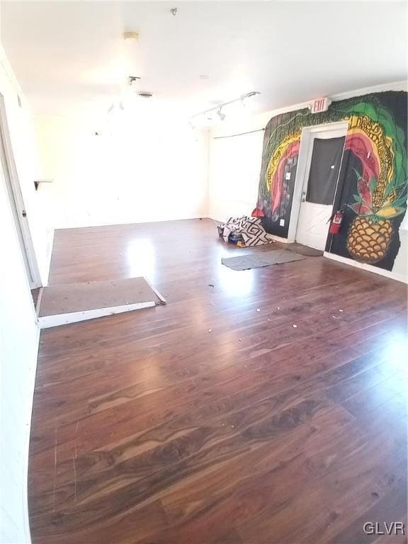 unfurnished room with wood finished floors