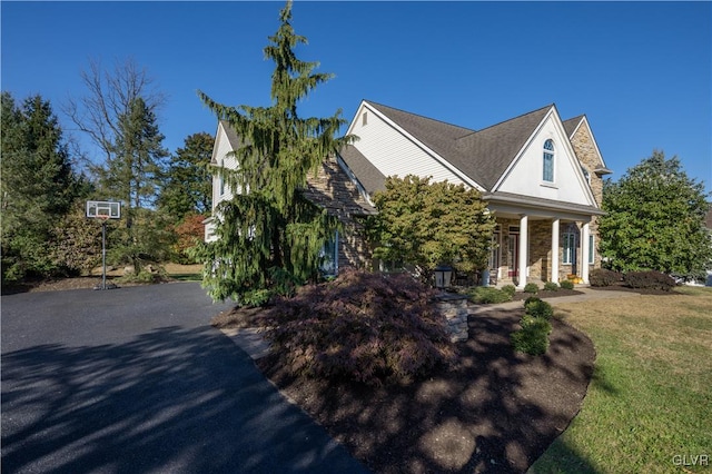 view of home's exterior with a yard