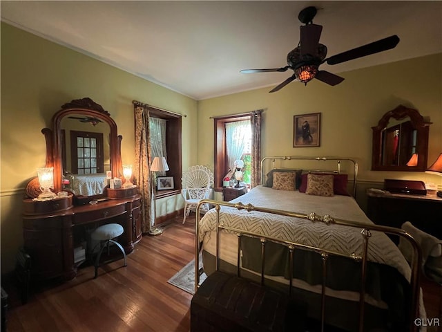 bedroom with wood finished floors and ceiling fan