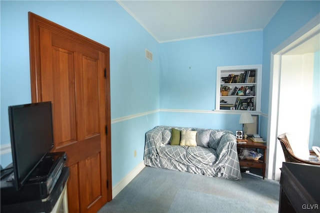 carpeted office space featuring crown molding, built in features, baseboards, and visible vents