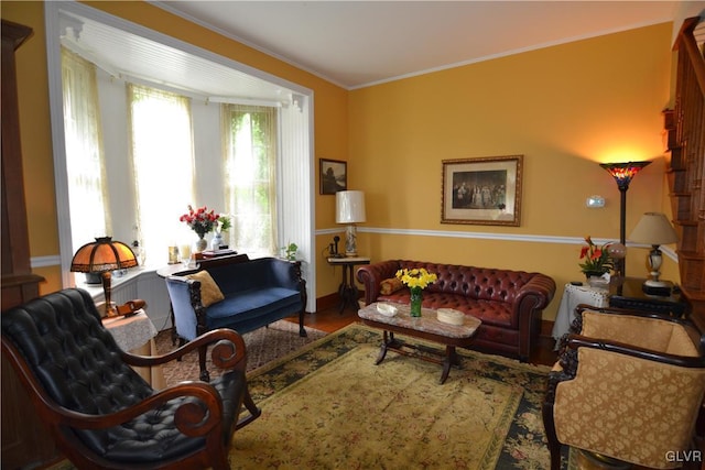 living room featuring wood finished floors and ornamental molding