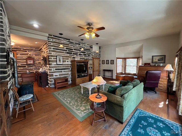 living room with a ceiling fan and wood finished floors