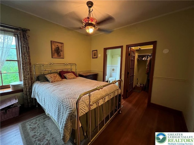 1321 Main St, Chapman, PA 18014 - bedroom with wood finished floors, a walk in closet, a closet, crown molding, and ensuite bath