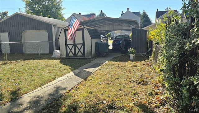 view of outbuilding featuring a carport and a yard