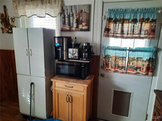 kitchen featuring butcher block countertops and white refrigerator