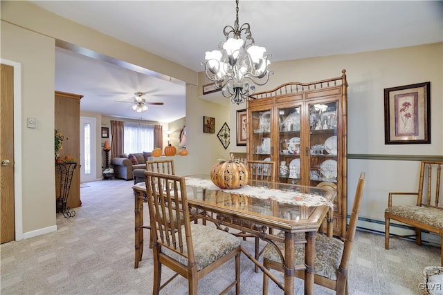 137 Outer Dr, Coolbaugh Twp, PA 18347 - dining space featuring light carpet, ceiling fan, a chandelier, and a baseboard radiator