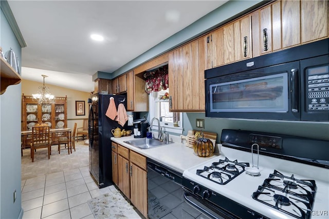 137 Outer Dr, Coolbaugh Twp, PA 18347 - kitchen with black appliances, light countertops, a chandelier, light tile patterned floors, and hanging light fixtures