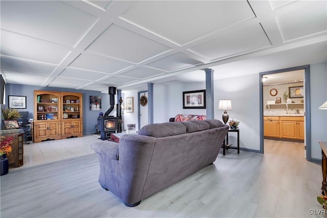 137 Outer Dr, Coolbaugh Twp, PA 18347 - living room featuring coffered ceiling, light wood-style floors, and a wood stove