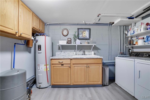 137 Outer Dr, Coolbaugh Twp, PA 18347 - laundry room with water heater, cabinet space, independent washer and dryer, light wood-style floors, and concrete block wall