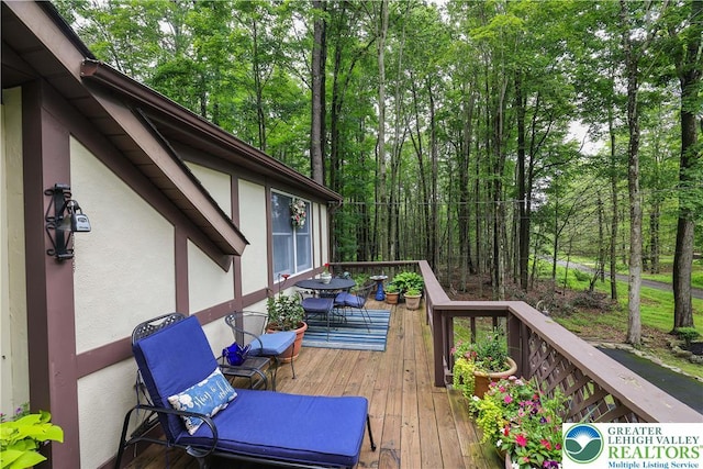 137 Outer Dr, Coolbaugh Twp, PA 18347 - wooden deck with outdoor dining area