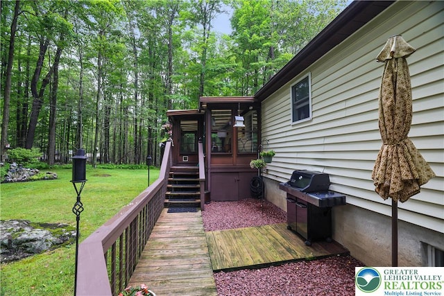 137 Outer Dr, Coolbaugh Twp, PA 18347 - wooden deck featuring area for grilling and a lawn