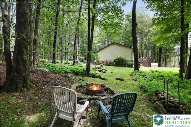 137 Outer Dr, Coolbaugh Twp, PA 18347 - view of green lawn with an outdoor fire pit