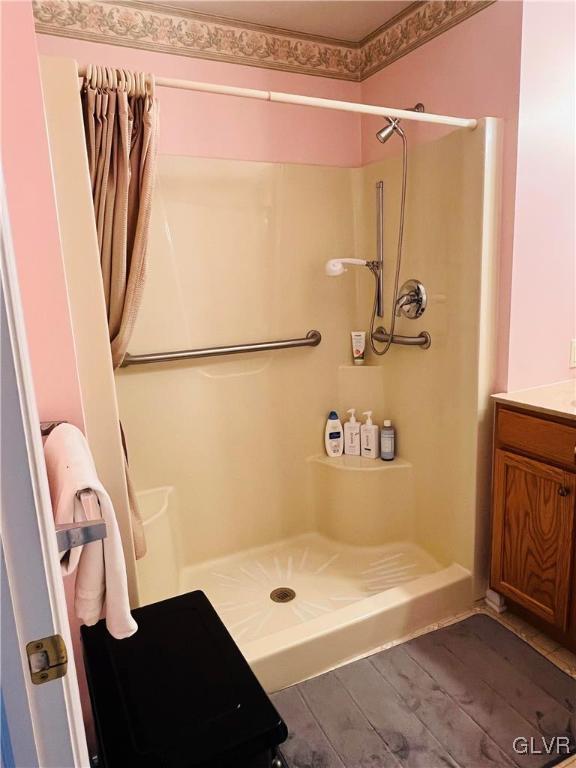 bathroom with vanity, wood-type flooring, and a shower with shower curtain