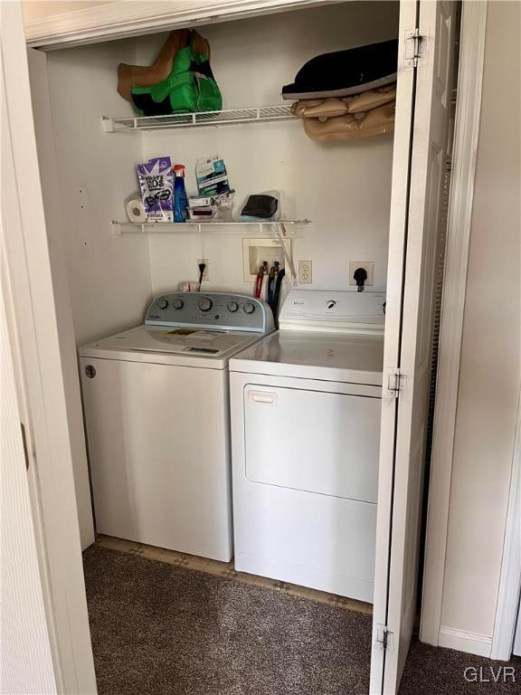 laundry area featuring dark carpet and independent washer and dryer