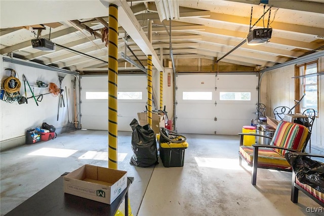 garage featuring a garage door opener and a carport