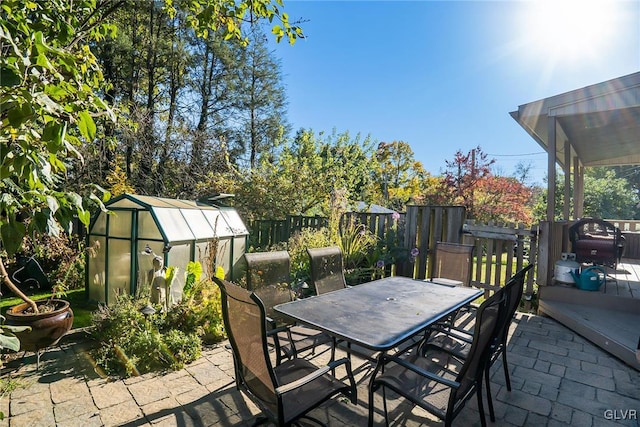 view of patio / terrace featuring an outbuilding