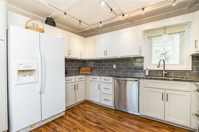 kitchen featuring white cabinets, dark hardwood / wood-style floors, and white appliances