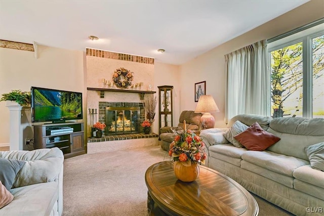 living room with carpet floors and a fireplace