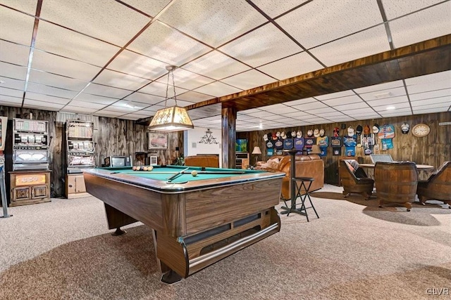 game room with a paneled ceiling, wooden walls, billiards, and carpet