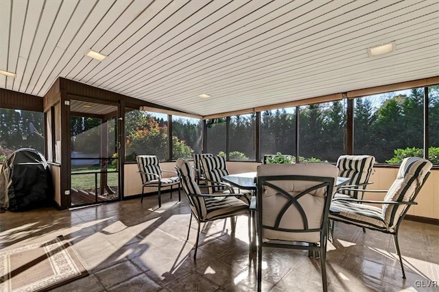 sunroom / solarium featuring wooden ceiling