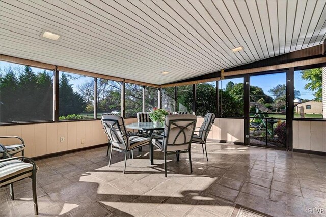 sunroom / solarium featuring wooden ceiling and plenty of natural light