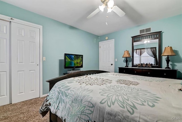 bedroom with a closet, carpet flooring, and ceiling fan