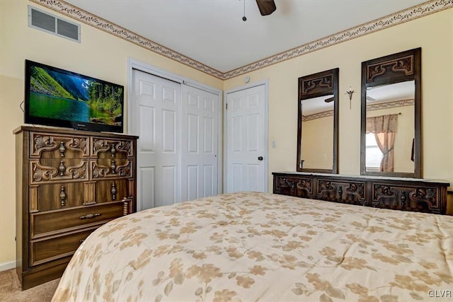 carpeted bedroom with ceiling fan