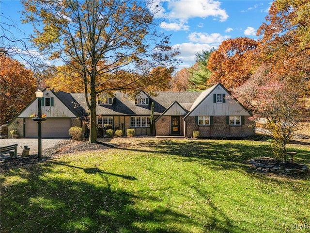 view of front of house with a front lawn and a garage