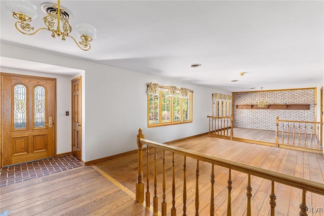 foyer entrance with a healthy amount of sunlight and wood-type flooring