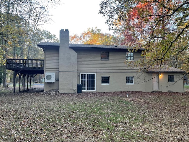 rear view of house with a wooden deck