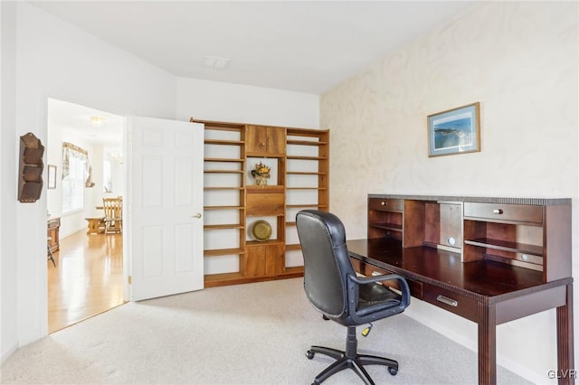 office space with light colored carpet