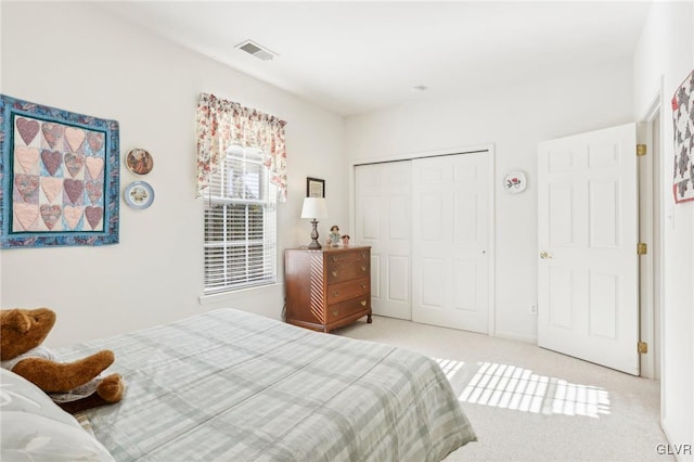 carpeted bedroom with a closet