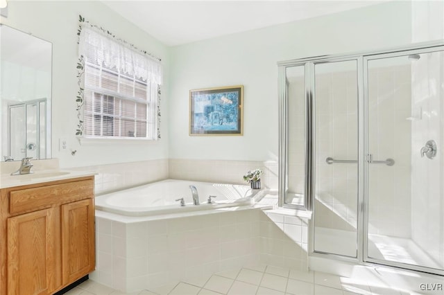 bathroom featuring vanity, tile patterned floors, and shower with separate bathtub