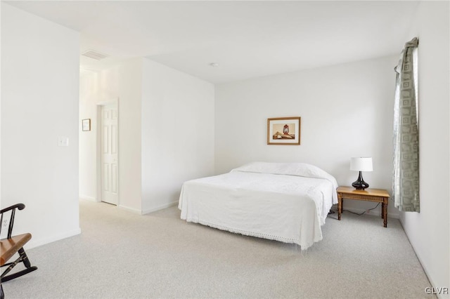 bedroom featuring light carpet