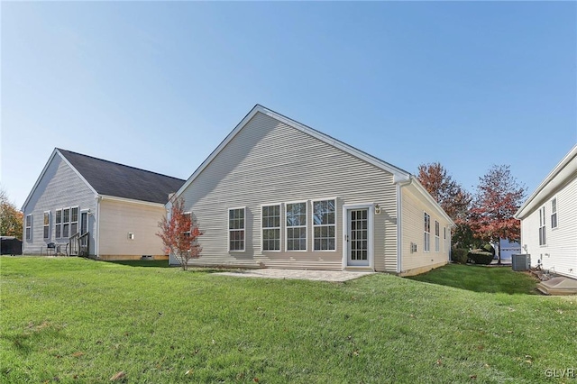 rear view of property with central AC, a lawn, and a patio