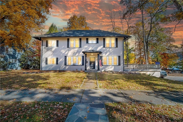 view of front of property with a lawn