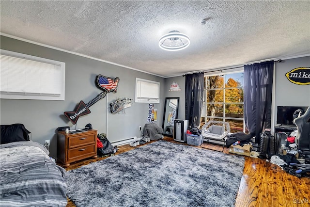 bedroom with a baseboard radiator, wood-type flooring, a textured ceiling, and ornamental molding