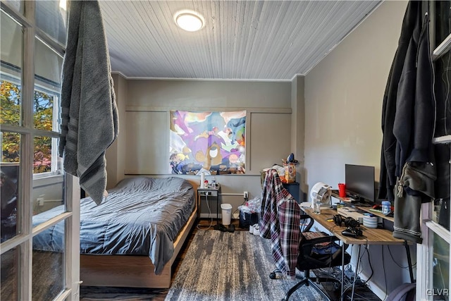 bedroom featuring crown molding and hardwood / wood-style floors