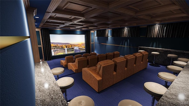 home theater with coffered ceiling and dark colored carpet