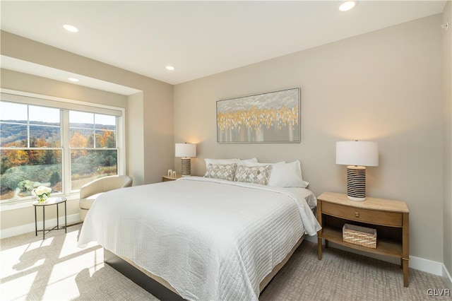 bedroom featuring light carpet