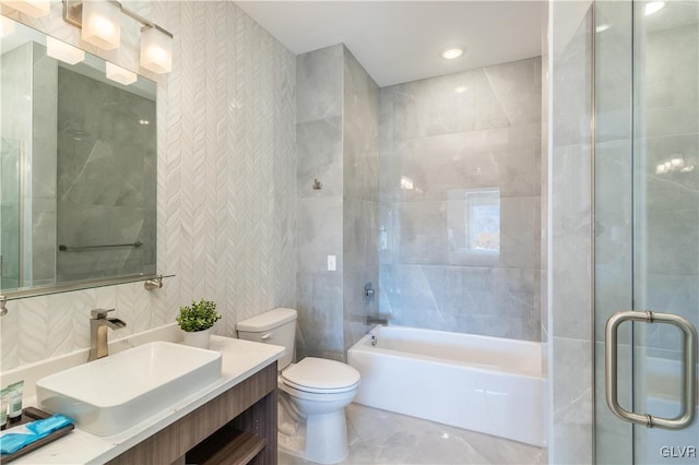 full bathroom featuring vanity, toilet, and separate shower and tub