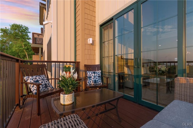 view of balcony at dusk