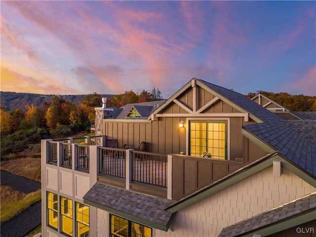 view of back house at dusk