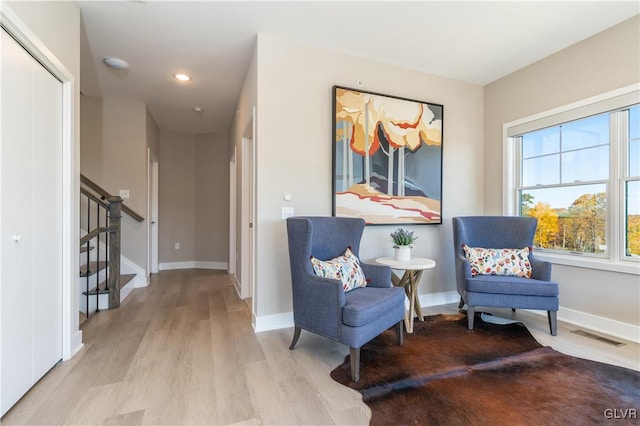 sitting room featuring light hardwood / wood-style flooring